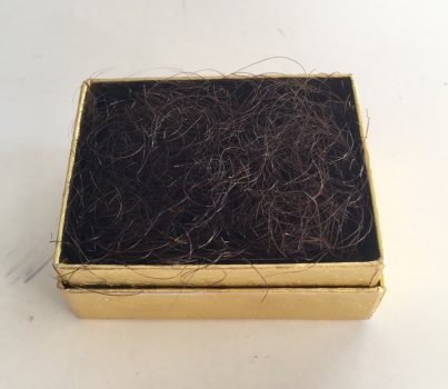 Pubic hair in gold box